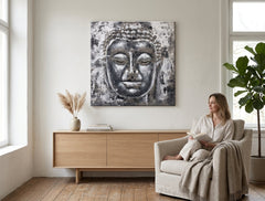 Рачно насликана слика на платно со мотив BUDHA, Buddha во бело-сиво нијанси закачена во ентериер на дневна соба, мирна атмосфера, духовност – ентериер